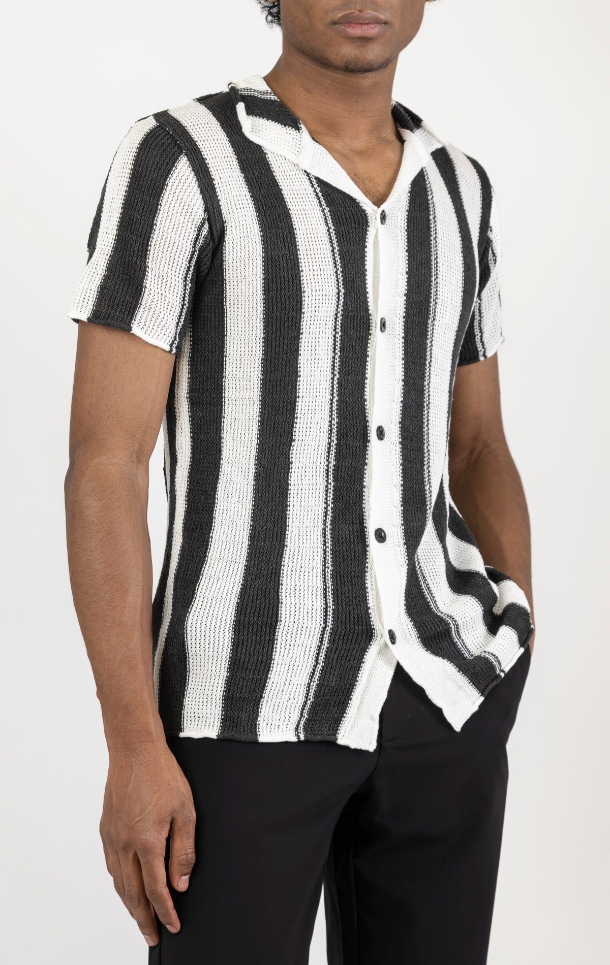 Men's openwork knit polo tee. The polo tee is made from a high-quality openwork knit fabric (50% cotton, 50% acrylic) and features a tailored fit, a classic polo collar with buttons, and short sleeves with intricate openwork detailing throughout the fabric.